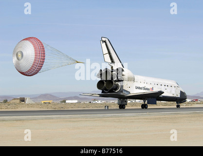 With its drag chute deployed Space Shuttle Discovery slows to a stop ...