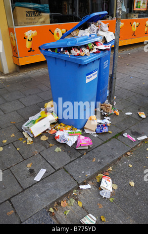 Overflowing paper bins in Haidhausen, Munich, Bavaria, Germany, Europe Stock Photo