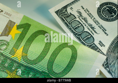 One hundred dollar bill and one hundred euro bill Stock Photo