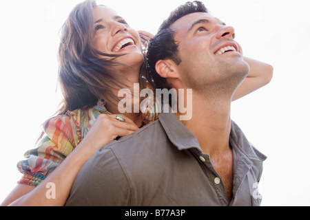 Smiling couple looking up Stock Photo