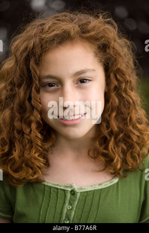 Smiling young red-headed girl. Stock Photo