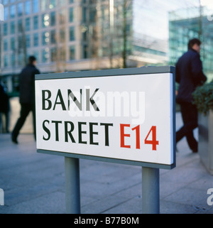 Pedestrians passing the Bank Street E14 sign Canary Wharf, London England UK  KATHY DEWITT Stock Photo