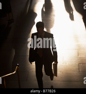 Businessman climbing steps Grand Central Station Stock Photo