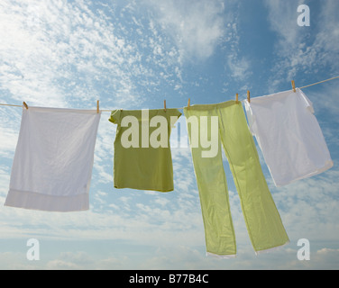 Clothes hanging from clothesline Stock Photo