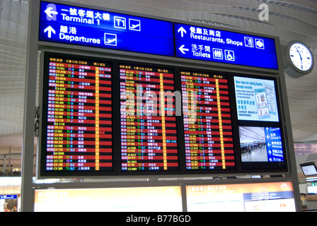 Illuminated depature board, Terminal.2, Hong Kong International Airport, Lantau Island, Hong Kong, People's Republic of China Stock Photo