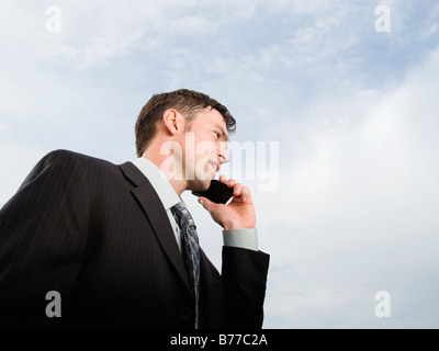 Close up of businessman talking on cell phone Stock Photo
