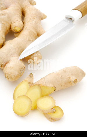 Ginger rhizome (Zingiberaceae), whole and sliced, with knife