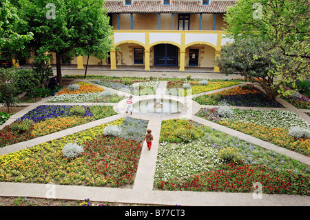 Gardens with fountain, Espace Van Gogh cultural centre, former hospital, Arles, Bouches-du-Rhone, Provence-Alpes-Cote d'Azur Stock Photo
