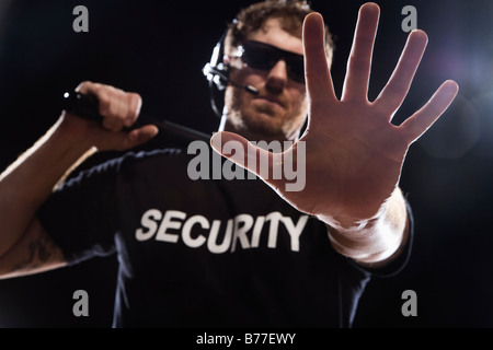 Security guard extending hand Stock Photo