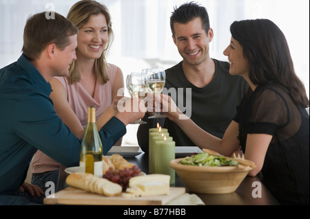 Couples toasting wine glasses Stock Photo