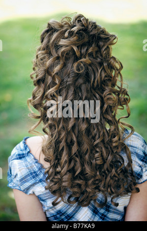 Young girl with long curly hair Stock Photo