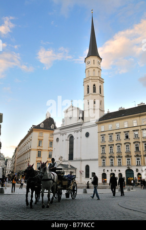 Viennese horse-drawn buggy, Fiaker, in front of St. Michael's Church, Michaelerkirche, Michaelerplatz, Vienna, Austria, Europe Stock Photo