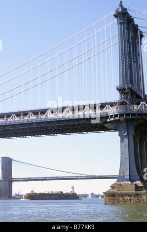 New York, Manhattan bridge in foreground, with Brooklyn bridge beyond, seen from riverside walk. Stock Photo