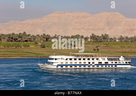 View of West Thebes over the Nile with cruise ship, Luxor, Egypt, Africa Stock Photo