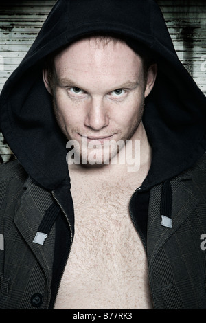 Portrait of a young man wearing a hooded sweatshirt Stock Photo