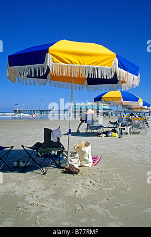 People beach umbrellas Daytona Beach Florida Stock Photo