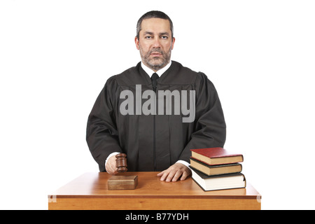 A male judge in a courtroom striking the gavel and pronounces sentence Stock Photo