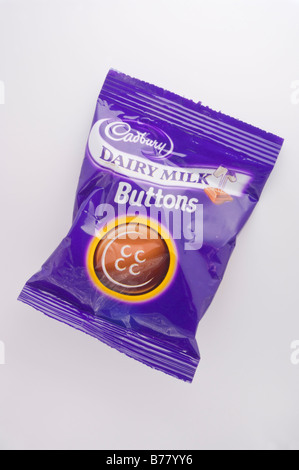 A packet of Cadburys dairy milk chocolate buttons snack made by cadbury Stock Photo