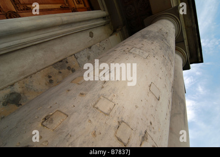 Remains of Warsaw Uprasing from 1944 against Nazi occupation. Filled bullets holes in column of Palace of the Republic. Stock Photo