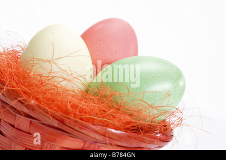 Easter nest with coloured eggs Stock Photo