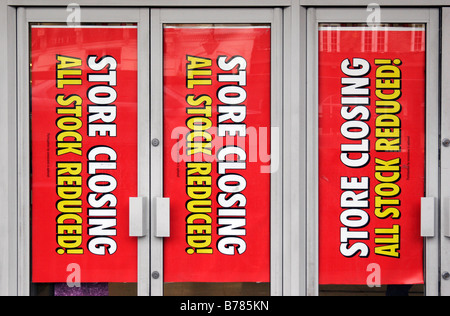 Store Closing signs in the window of the Swiss Cottage Woolworths on London's Finchley Road Stock Photo