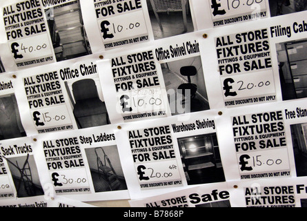 Stock clearance notices in a Woolworths Store in Finchley Road, London Stock Photo