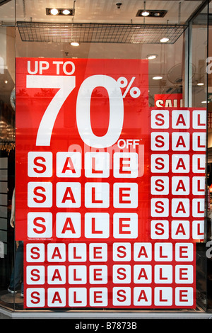 Sign in a retail store window advertising up to 70% off. Stock Photo
