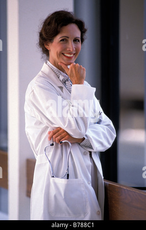 Portrait of female doctor in hospital corridor Stock Photo