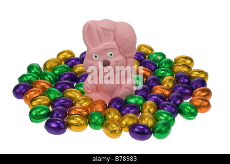 cute easter bunny surrounded by easter eggs isolated on a white background Stock Photo