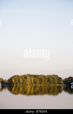 Seacape with two anglers in a boat on a late summer evening, Uckermark, Brandenburg, Germany, Europe Stock Photo