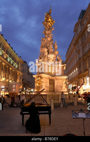 Pestsaeule, Dreifaltigkeitssaeule, and pianist SoRyang on the grand piano in Graben, city, Vienna, Austria, Europe Stock Photo