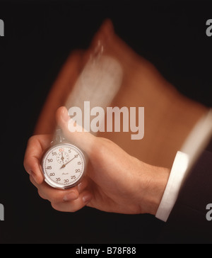Hand with stop watch Stock Photo