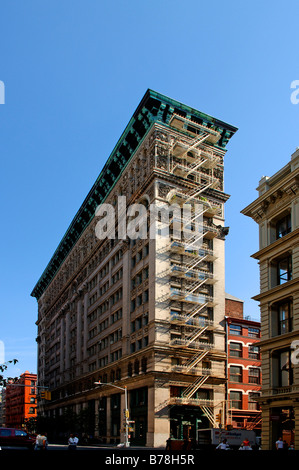 Slim high rise with fire escape ladders, Downtown, New York City, USA Stock Photo