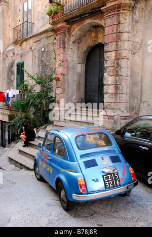 Blue Fiat 500 in the historic centre of Tropea, Vibo Valentia, Calabria, South Italy, Europe Stock Photo