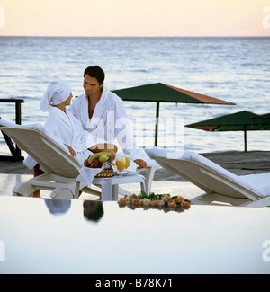 Couple relaxing at resort. Stock Photo