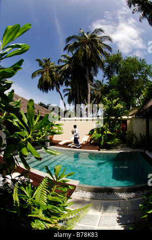 Private swimming pool and champagne in champagne cooler, deluxe suites in Laguna Resort, The Maldives, Indian Ocean Stock Photo