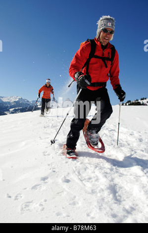 Snowshoe hikers, Zweisimmen, Rueblihorn, Gummfluh, Saanenland, Gstaad, West Alps, Bernese upper country, Switzerland, Europe Stock Photo