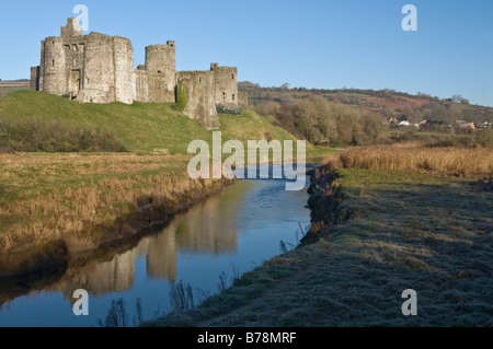 Kidwelly Cydweli Castle Carmarthenshire reflected in the River Gwendraeth Stock Photo