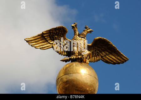 Golden, double-headed Russian eagle on the granite obelisk to commemorate Tsar Nicholas I and his consort Alexandra Feodorovna, Stock Photo