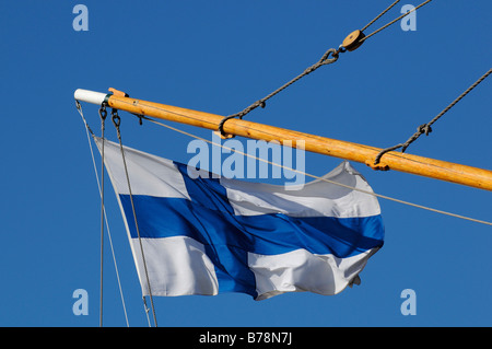 Finnish flag on a sailing ship in the port of Helsinki, Finland, Europe Stock Photo