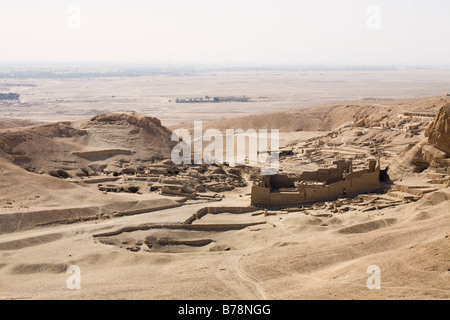 View over the Theban Hills on the West Bank of the Nile, looking towards Deir el Medina and Ptolemaic Temple, Luxor Egypt Stock Photo