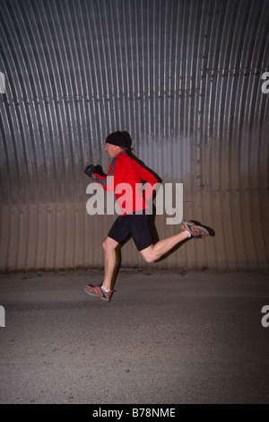 A man running through a tunnel in Reno in Nevada Stock Photo