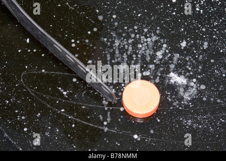 Ice hockey stick and puck, elevated view Stock Photo
