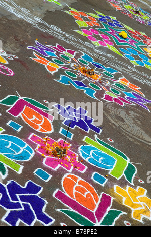 Rangoli designs in an Indian street outside a hindu temple during the ...