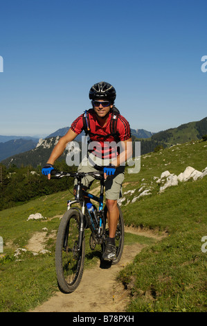 Mountain biker on Kampenwand, Chiemgau, Bavarian Pre-Alps, Bavaria, Germany, Europe Stock Photo