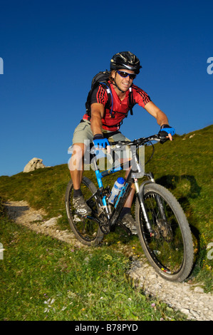Mountain biker on Kampenwand, Chiemgau, Bavarian Pre-Alps, Bavaria, Germany, Europe Stock Photo