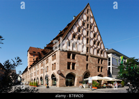 Granary on Hallplatz Square, former salt and grain storage, today Barfuesser brewery with restaurant and several shops, old cit Stock Photo