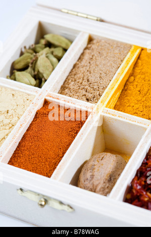 Variety of spices in wooden box, elevated view, close-up Stock Photo