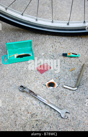 Bicycle repair kit and bicycle, elevated view Stock Photo