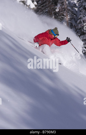 A woman skiing powder snow at Northstar at Tahoe ski area near Lake Tahoe in California Stock Photo